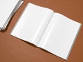 Open magazine cover with blank white page mockup on leather substrate Royalty Free Stock Photo