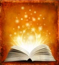 Open magic book with lights Royalty Free Stock Photo