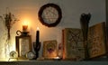 Open magic book with spells, tarot cards, crystals, candles and pentagram