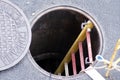 Open manhole in the ground with ladder going down Royalty Free Stock Photo