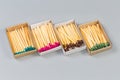 Open matchboxes with wooden household matches with heads different colors Royalty Free Stock Photo