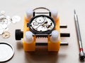 open mechanical watch in yellow holder closeup Royalty Free Stock Photo