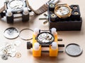 open mechanical watches in holders on wooden table Royalty Free Stock Photo