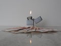 Open metal lighter with flame on black is background Royalty Free Stock Photo