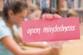 Open-mindedness against cute pupil using tablet computer in library Royalty Free Stock Photo