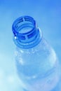 Open mineral water bottle in blue Royalty Free Stock Photo