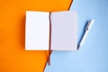 Open mockup notepad on geometric orange and blue background