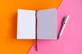 Open mockup notepad on geometric orange and pink background