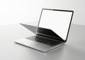 Open modern laptop computer showing blank screen on white surface transparent background Royalty Free Stock Photo