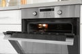 Open modern oven built in kitchen furniture Royalty Free Stock Photo