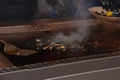 Open mussels on the grill at floating market ready to eat Royalty Free Stock Photo