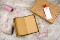 open noteboock with old vintage paper, pencil, gift box with blank white label, hearts