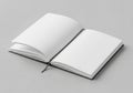 An open notebook with a black hardcover lying on a light gray Royalty Free Stock Photo