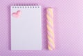 Open notebook with a blank page, marshmallow stick and little valentine on a background of polka dot Royalty Free Stock Photo