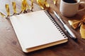 open notebook with blank pages next to cup of coffee Royalty Free Stock Photo