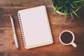 open notebook with blank pages next to cup of coffee Royalty Free Stock Photo