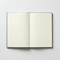 Open notebook with blank, unlined pages, set on a white surface. Pages are cream- Royalty Free Stock Photo