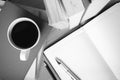 Open notebook with book and coffee cup black and white color to Royalty Free Stock Photo