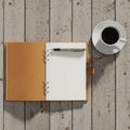 Open notebook with a brown leather cover on a rustic wooden surface Royalty Free Stock Photo