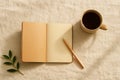 Open Notebook with Coffee and Pencil on Linen Fabric Royalty Free Stock Photo