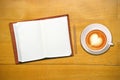 Open notebook with cup of coffee Royalty Free Stock Photo