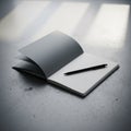 An open notebook with a dark cover sits on a textured gray surface Royalty Free Stock Photo