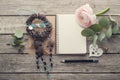 Open notebook, dream catcher and heart