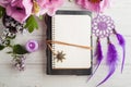 Open notebook, dream catcher, peony and lilac