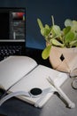 Open notebook with laptop on a black table Royalty Free Stock Photo