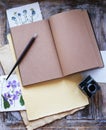 Open notebook, pen and inkwell on wooden table Royalty Free Stock Photo