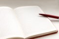 Open notebook with pen on white background closeup Royalty Free Stock Photo