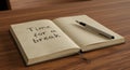 Open notebook with a pen and the words Time for a break written on it Royalty Free Stock Photo