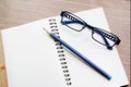 Open notebook with pencil and glasses Royalty Free Stock Photo