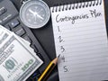Open notebook with the phrase 'Contingencies Plan' written in blue ink on the page Royalty Free Stock Photo