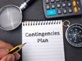 Open notebook with the phrase 'Contingencies Plan' written on it Royalty Free Stock Photo