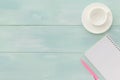 Open notebook with pink pen and coffeecup Royalty Free Stock Photo