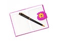 Open notebook in a purple cover with a black ballpoint pen on a Royalty Free Stock Photo