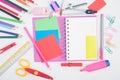 Open notebook and school or office tools on white background Royalty Free Stock Photo