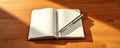 Open notebook and silver pen resting on wooden table during afternoon light, inviting thoughts and creativity Royalty Free Stock Photo