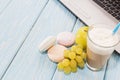 Open notebook, white mug with coffee, marshmallows.