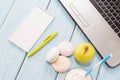 Open notebook, white mug with coffee, marshmallows.