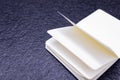 Open notebook with white pages on a black background. book for making business notes. No idea on the white sheet, pages without Royalty Free Stock Photo