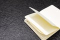 Open notebook with white pages on a black background. book for making business notes. No idea on the white sheet, pages without Royalty Free Stock Photo