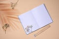 Open notebook, wooden pencil on beige background, top view Royalty Free Stock Photo