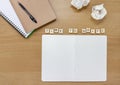 Open notebook on a writer or artists desk, with tiles spelling out `Time To Write`