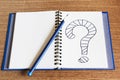 Open Notebook writing question mark on it Royalty Free Stock Photo
