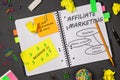 Open notepad with affiliate marketing sketch