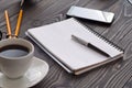 Open notepad with blank pages, pen and cup of coffee Royalty Free Stock Photo