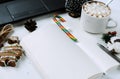 Open journal of, colorful Lollipop, a Cup of hot chocolate with marshmallows, cookies, handle, edge of the laptop Royalty Free Stock Photo