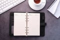 open diary, keyboard and tea on table Royalty Free Stock Photo